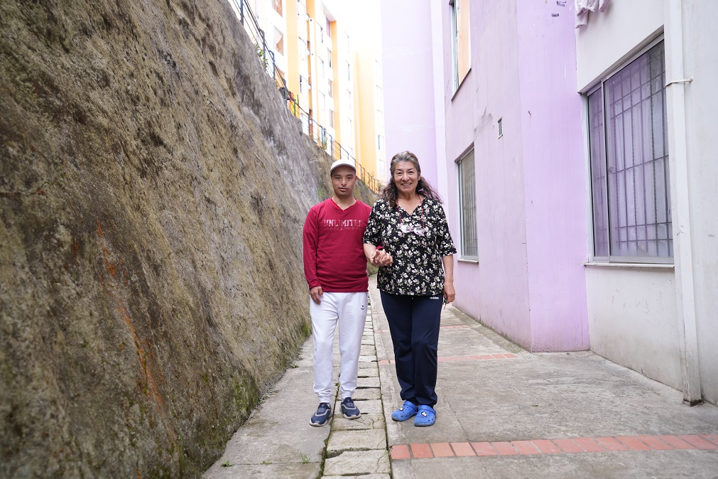 Gloria and her son Sebastian outside of their home, in Pasto (Colombia).; }}