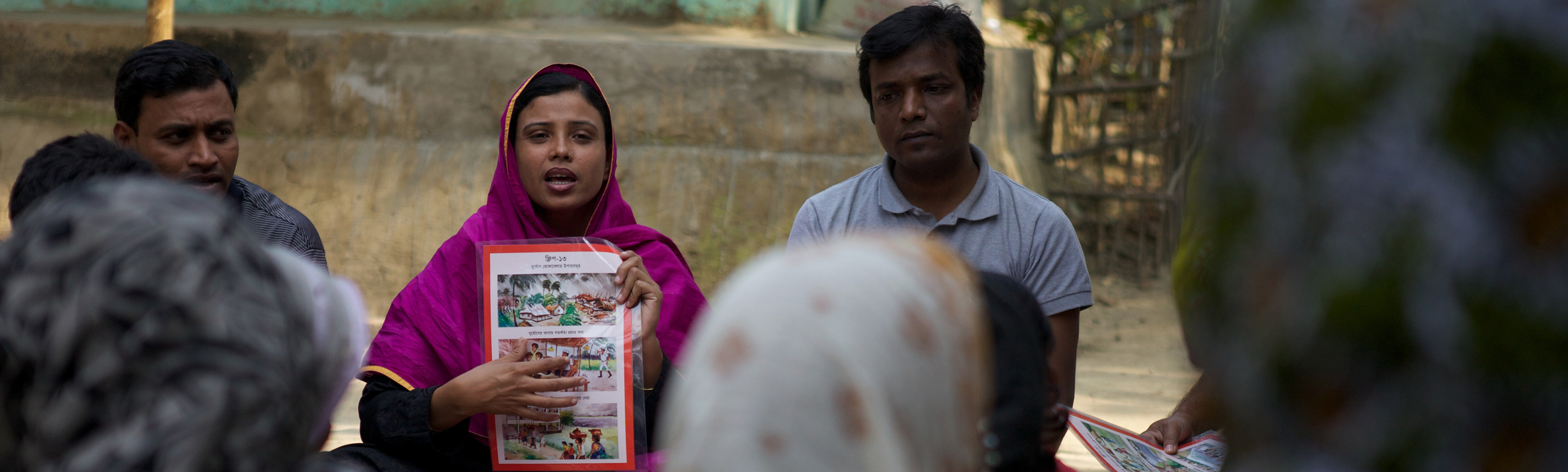 Bangladesh, Disaster Risk Management Project. Sohag from YPSA, partner of HI, is explaining the various hasards faced by the fishermen community.