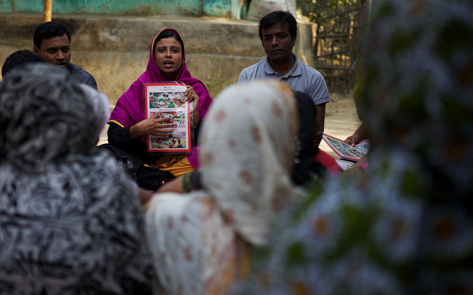 Bangladesh, Disaster Risk Management Project. Sohag from YPSA, partner of HI, is explaining the various hasards faced by the fishermen community.