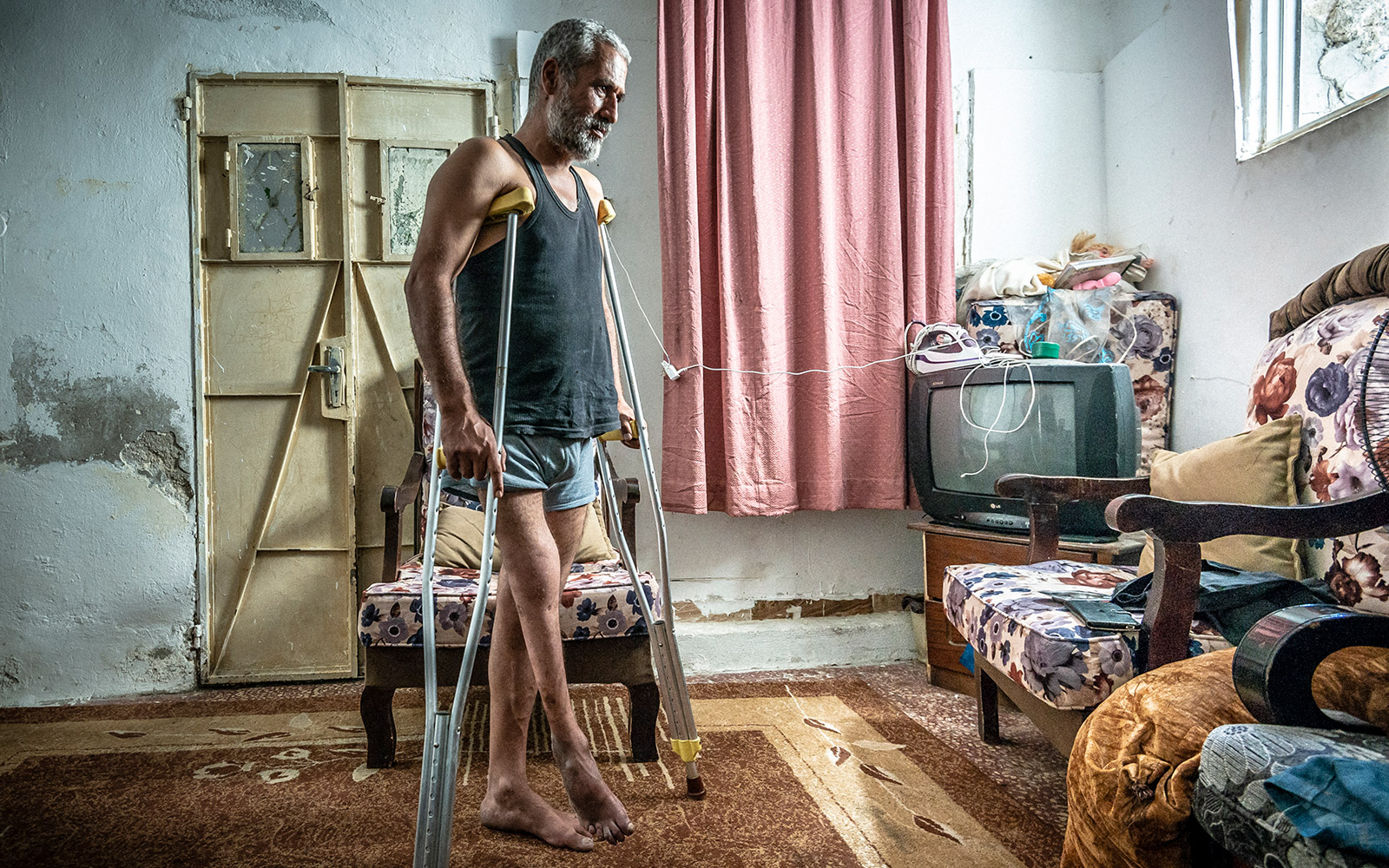 Jordan, Ibrahim was wounded in the leg during a bombing in Syria. He moves with the help of crutches.
