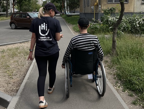 Mykhailo Osipov, survivor of fpv-drone attack in January 2026, internally displaced person from the town of Yarova, Donetsk region, with physiotherapist Maria Topka during at- home physical rehabilitation session. Dnipro, April 2026 