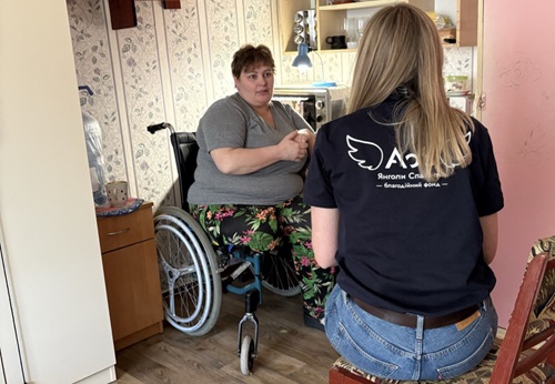 Olena Glukhovshchenko, an internally displaced woman from Bohdanivka, Zaporizhzhia region, who survived a rocket attack and underwent leg amputation, during a meeting with a case manager of CF “Angels of Salvation”, Zaporizhzhia, May 2026 