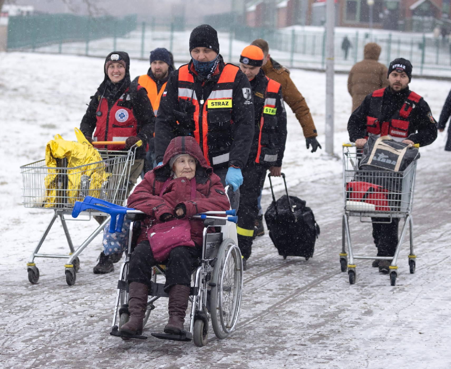 Galaina, 87 years old, crosses the border from Ukraine to Poland at the Medyka crossing.