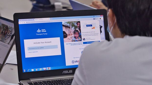 A rehabilitation professional uses HI's OpenTeleRehab software during a training course provided by the association in Vietnam in 2021.; }}