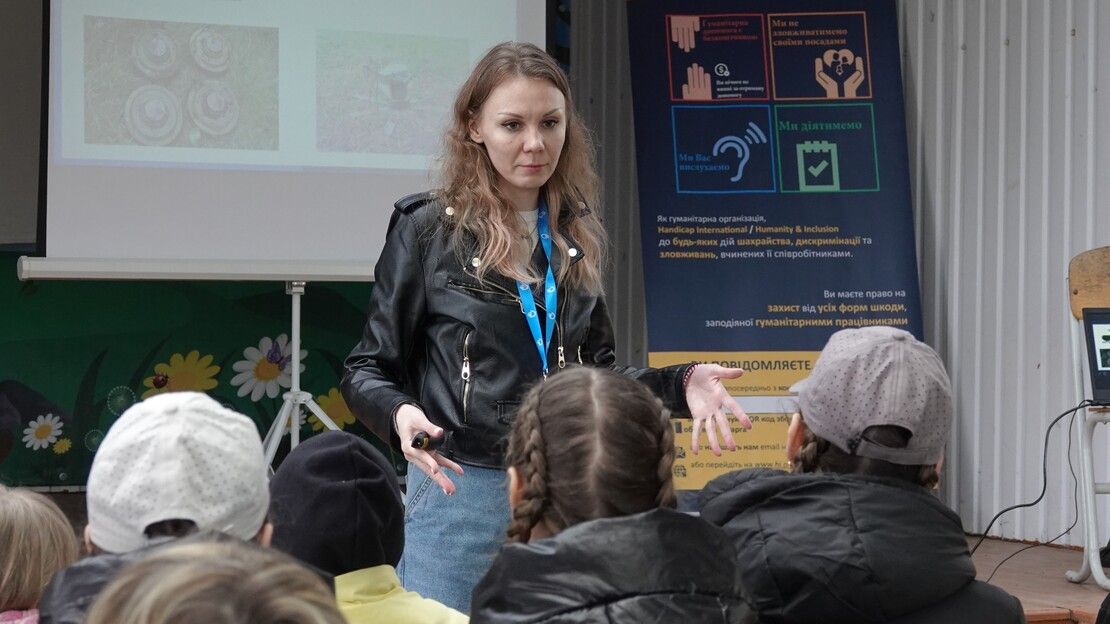 Anita, HI EORE agent, speaks at a risk education session with displaced persons in the Poltava region.; }}