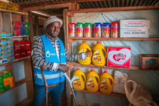 An entrepreneur with disability in his shop in Kenya. © HI