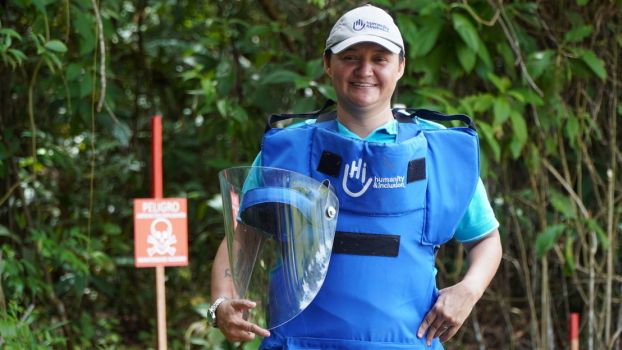 Marta Quintero in her demining gear, Chaparral region of Colombia, September 2022.; }}