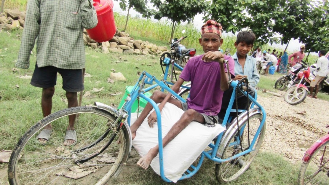 A person in a wheelchair stands where HI's activities take place.; }}