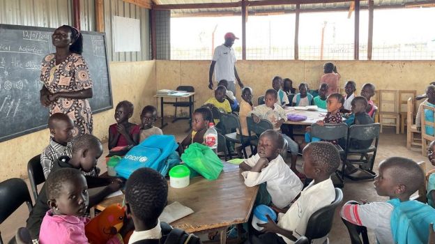 Susan, head teacher at the inclusive school in Kalobeyei refugee camp in Kenya, visits the students during a maths lesson. ; }}