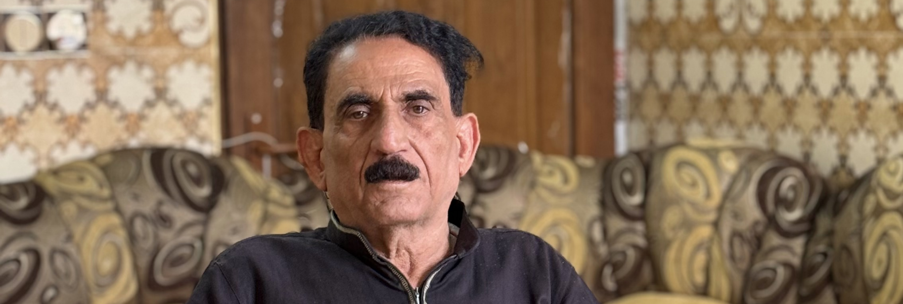 Hmoud in his living room.