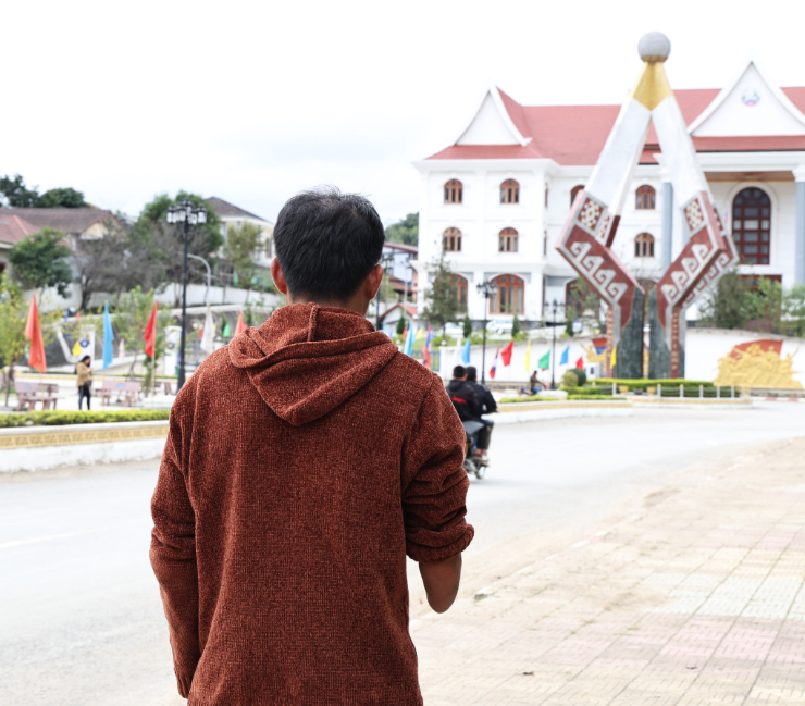 Mr Ngok stands in the streets of Sam Neua.